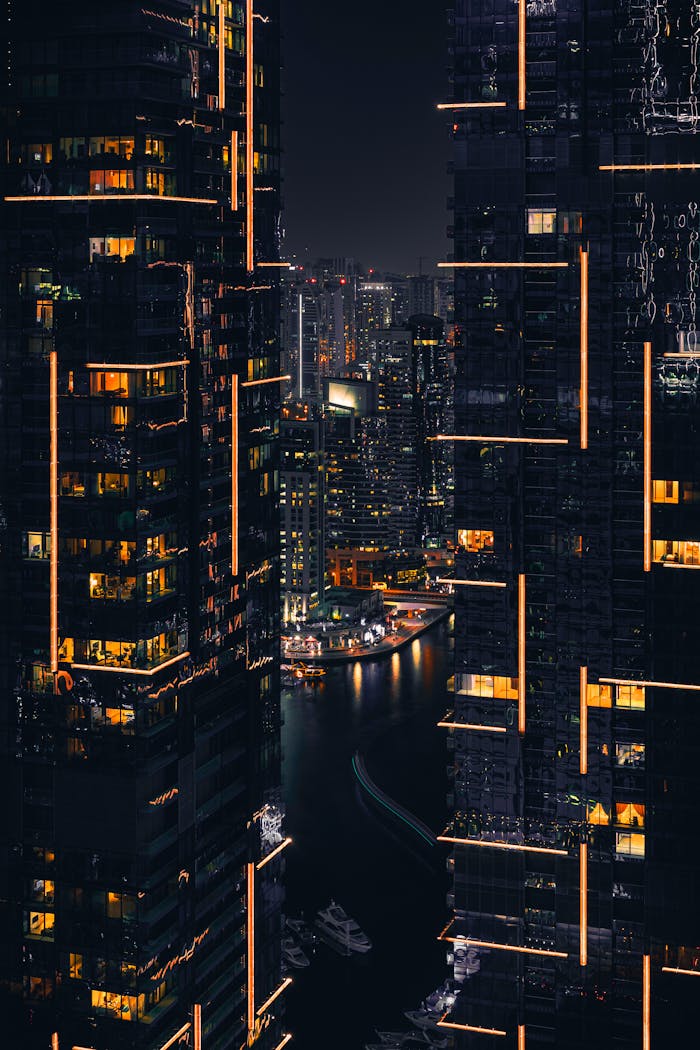 Home Captivating night view of Dubai skyscrapers illuminated against the dark sky. Perfect for tech and urban themes.